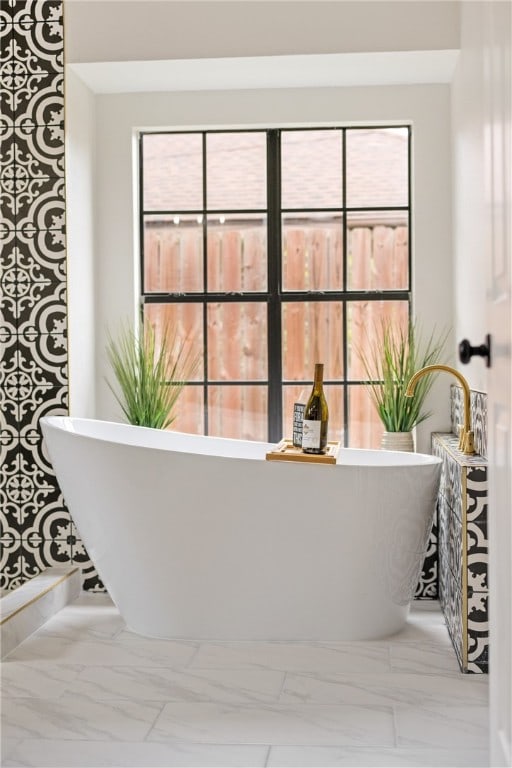 4530 Megal Dr, Corpus Christi, TX 78413 - full bath with marble finish flooring, plenty of natural light, and a soaking tub