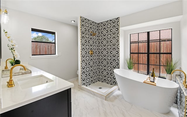 4530 Megal Dr, Corpus Christi, TX 78413 - full bathroom with marble finish flooring, a freestanding tub, a walk in shower, and vanity