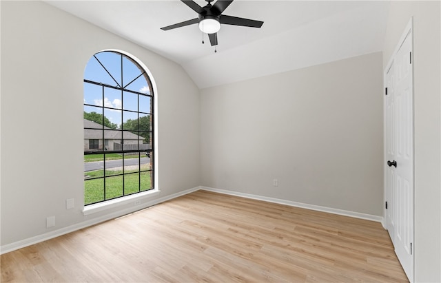 4530 Megal Dr, Corpus Christi, TX 78413 - spare room with light wood-style floors, baseboards, vaulted ceiling, and a ceiling fan