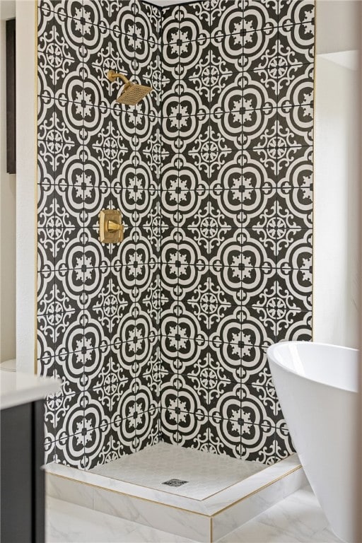 4530 Megal Dr, Corpus Christi, TX 78413 - full bathroom with a tile shower, a soaking tub, and marble look tiles