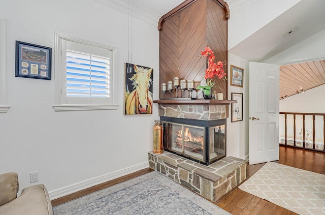 interior details with hardwood / wood-style floors, a fireplace, and crown molding