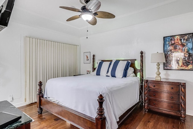 bedroom featuring dark hardwood / wood-style flooring and ceiling fan