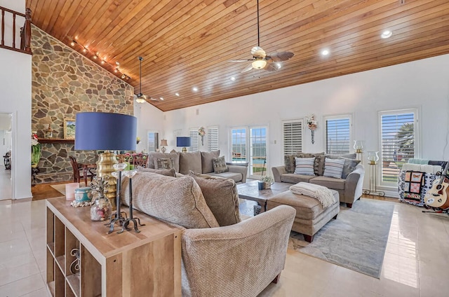 living room with high vaulted ceiling, wood ceiling, light tile patterned floors, and ceiling fan