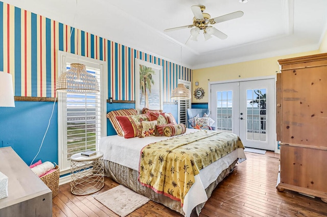 bedroom featuring french doors, wood-type flooring, ceiling fan, and access to exterior