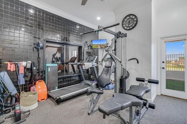 exercise room with tile walls, carpet flooring, and crown molding