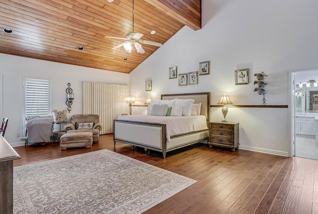 bedroom with ensuite bathroom, high vaulted ceiling, dark wood-type flooring, and ceiling fan