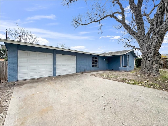 ranch-style home featuring a garage