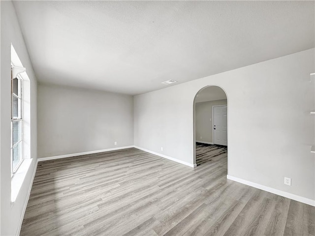 spare room with light hardwood / wood-style floors