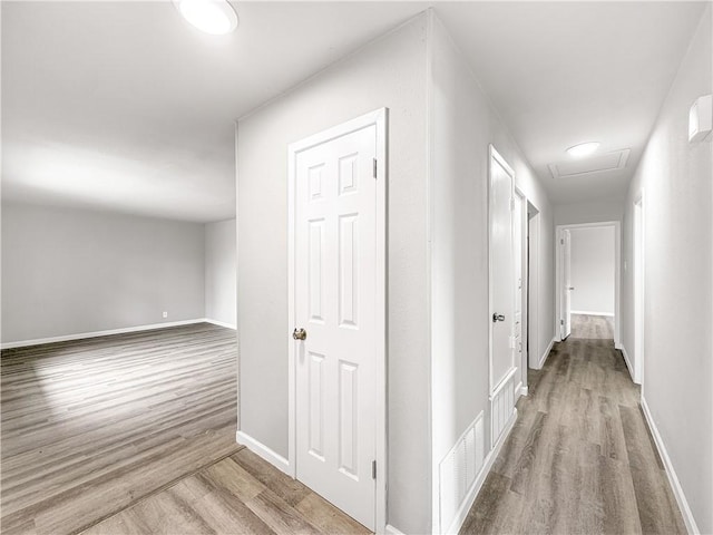 hallway featuring light hardwood / wood-style flooring