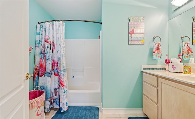 full bath with baseboards, shower / bath combo with shower curtain, vanity, and tile patterned floors