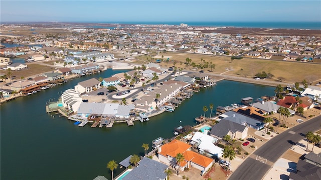 aerial view with a water view and a residential view