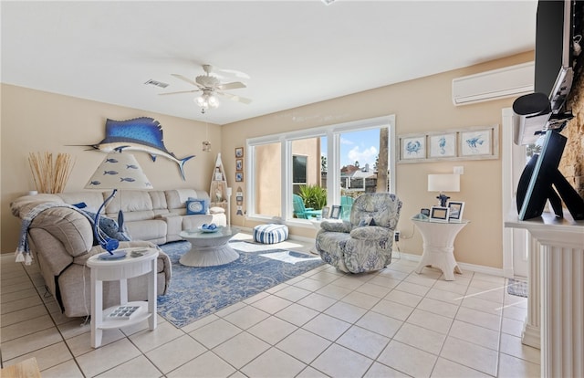 living room featuring visible vents, a ceiling fan, light tile patterned flooring, a wall mounted air conditioner, and baseboards