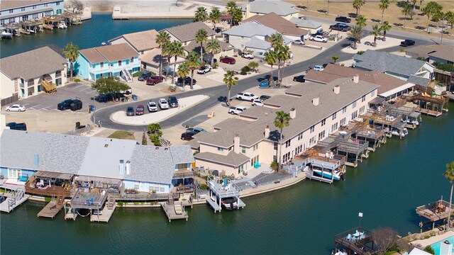 birds eye view of property with a water view and a residential view