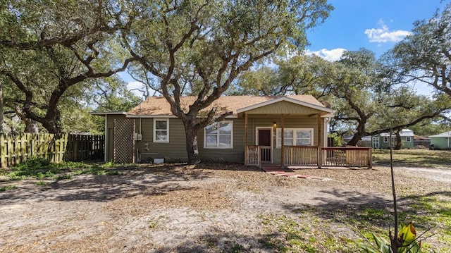 view of front of home featuring fence