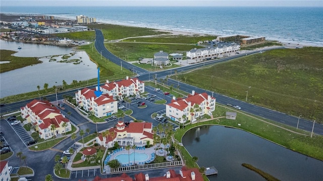 aerial view featuring a water view and a view of the beach