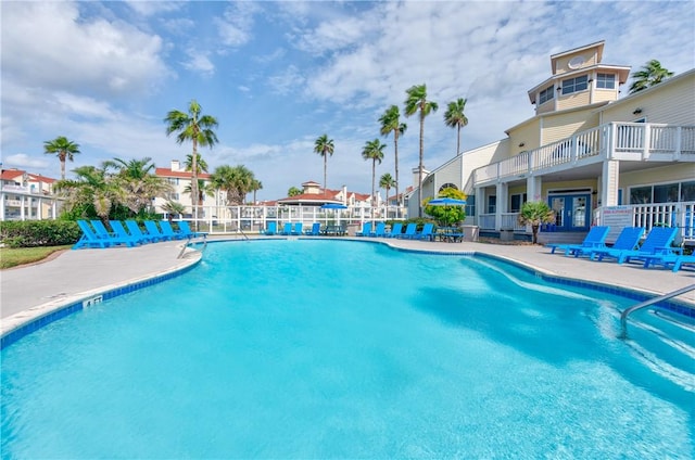 pool featuring a patio and fence