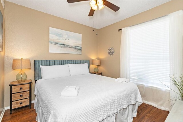 bedroom with hardwood / wood-style flooring and ceiling fan