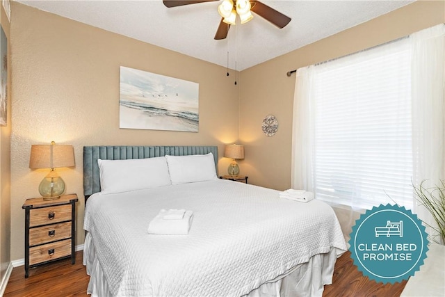 bedroom with wood-type flooring and ceiling fan