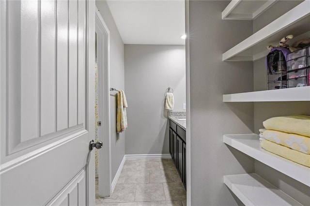 bathroom featuring tile patterned flooring and vanity