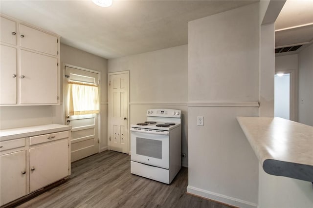 1522 Clodah Dr, Corpus Christi, TX 78404 - kitchen featuring white electric range, wood finished floors, light countertops, and white cabinetry