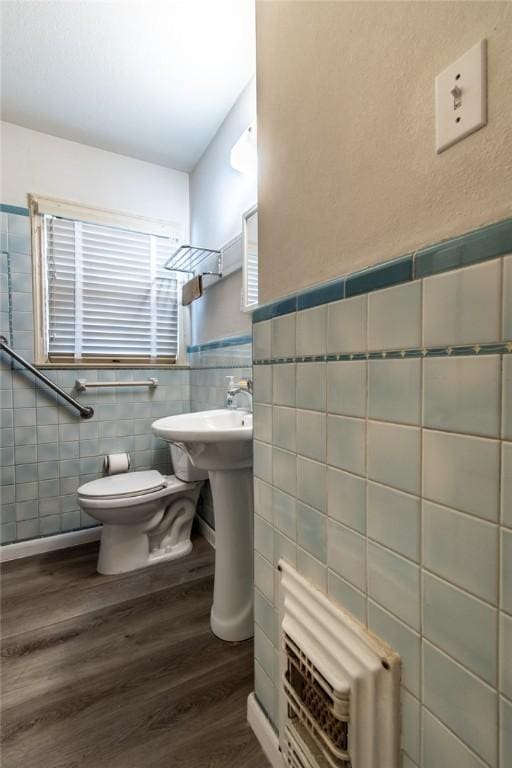 1522 Clodah Dr, Corpus Christi, TX 78404 - bathroom with tile walls, wood finished floors, and a wainscoted wall