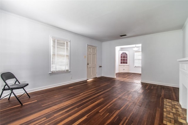 1522 Clodah Dr, Corpus Christi, TX 78404 - unfurnished living room with dark wood finished floors and ornamental molding
