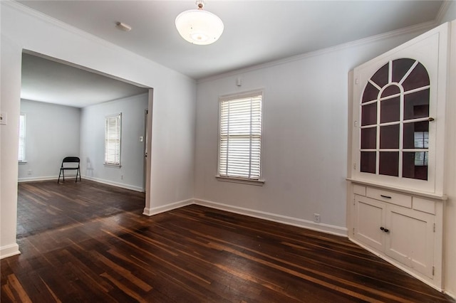 1522 Clodah Dr, Corpus Christi, TX 78404 - unfurnished dining area with dark wood-style floors and crown molding
