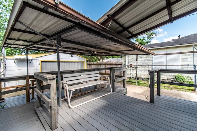 1522 Clodah Dr, Corpus Christi, TX 78404 - wooden terrace featuring a fenced backyard and a storage unit