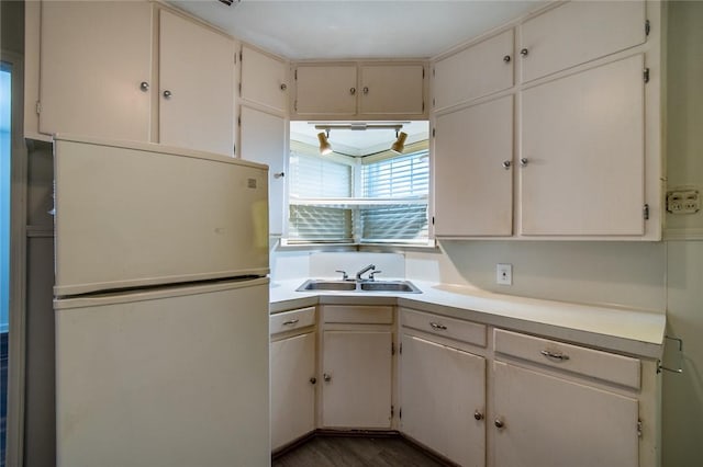 1522 Clodah Dr, Corpus Christi, TX 78404 - kitchen with freestanding refrigerator, light countertops, and wood finished floors