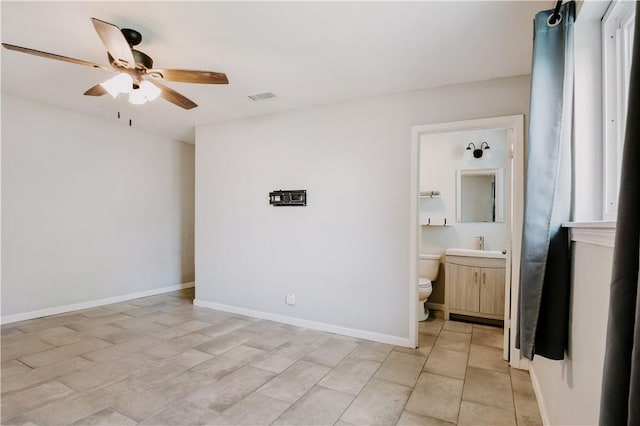 433 Pleiades Pl, Corpus Christi, TX 78418 - empty room featuring a ceiling fan, a sink, and baseboards