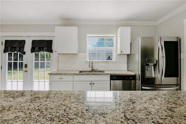 433 Pleiades Pl, Corpus Christi, TX 78418 - kitchen featuring appliances with stainless steel finishes, a sink, french doors, white cabinetry, and crown molding