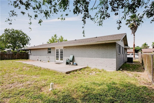 433 Pleiades Pl, Corpus Christi, TX 78418 - rear view of property featuring brick siding, a patio area, french doors, and central air condition unit