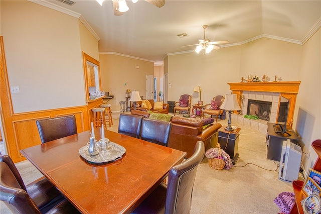 7014 Mona Lisa Cir, Corpus Christi, TX 78413 - carpeted dining area with ceiling fan, ornamental molding, and a tiled fireplace