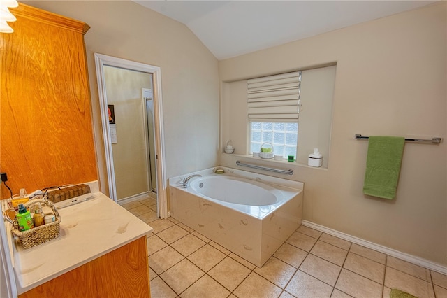 7014 Mona Lisa Cir, Corpus Christi, TX 78413 - bathroom featuring lofted ceiling, a garden tub, tile patterned flooring, a stall shower, and vanity