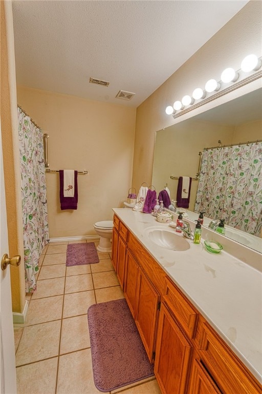 7014 Mona Lisa Cir, Corpus Christi, TX 78413 - full bathroom with vanity, tile patterned floors, a textured ceiling, and curtained shower