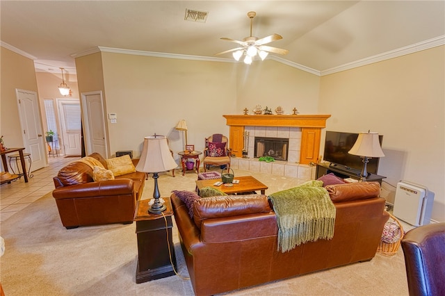 7014 Mona Lisa Cir, Corpus Christi, TX 78413 - carpeted living area featuring ornamental molding, ceiling fan, a tiled fireplace, and tile patterned flooring