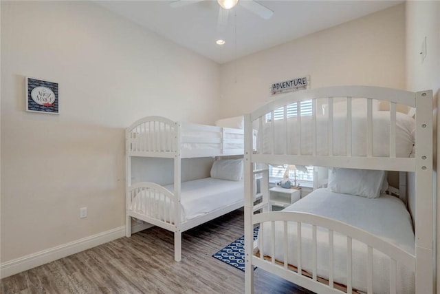 bedroom featuring ceiling fan and wood-type flooring