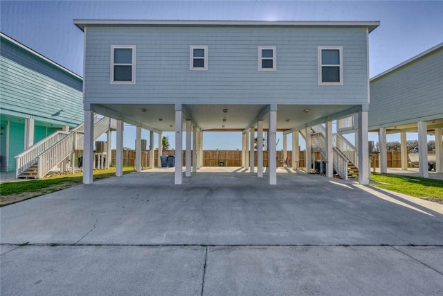 view of front of property featuring a carport