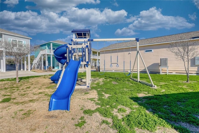 view of playground with a lawn