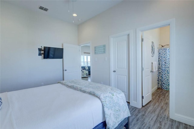 bedroom featuring wood-type flooring