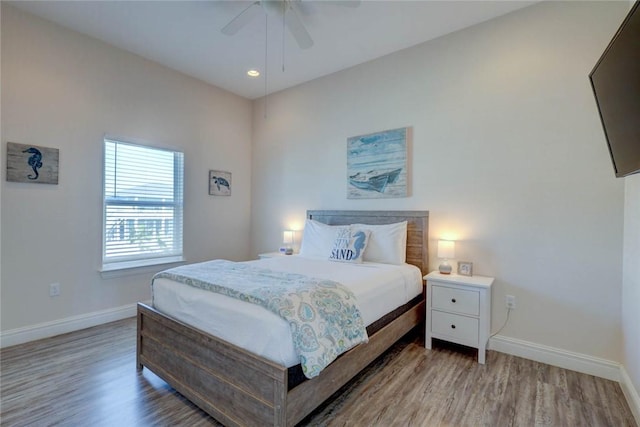 bedroom featuring hardwood / wood-style flooring and ceiling fan