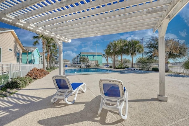 view of patio featuring a community pool and a pergola