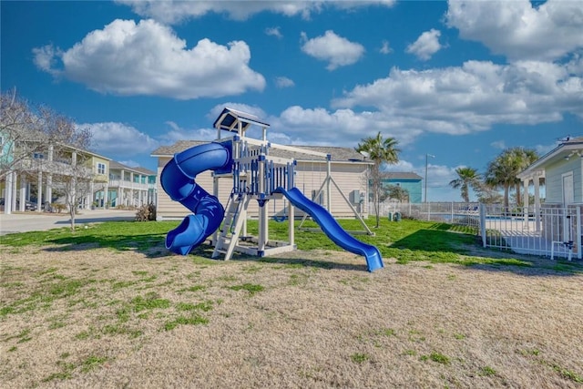 view of playground with a lawn