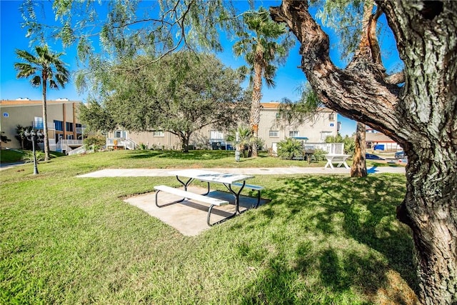 view of home's community featuring a lawn