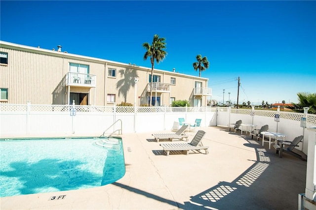 view of swimming pool with a patio