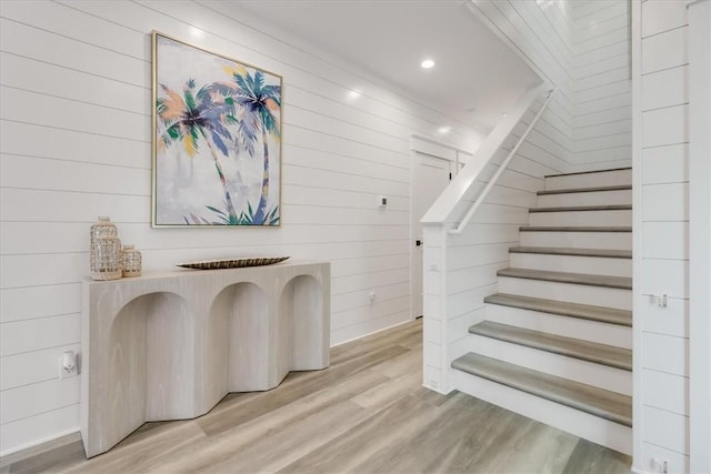 969 Banyan Beach Dr, Port Aransas, TX 78373 - stairs featuring wood walls, wood finished floors, and recessed lighting