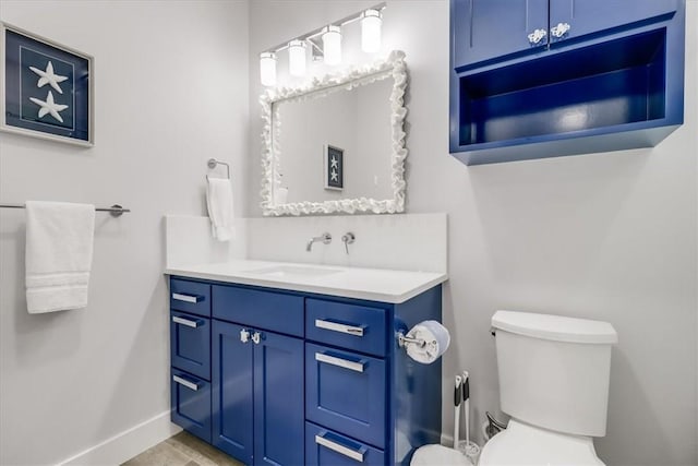 969 Banyan Beach Dr, Port Aransas, TX 78373 - bathroom featuring vanity, baseboards, and toilet