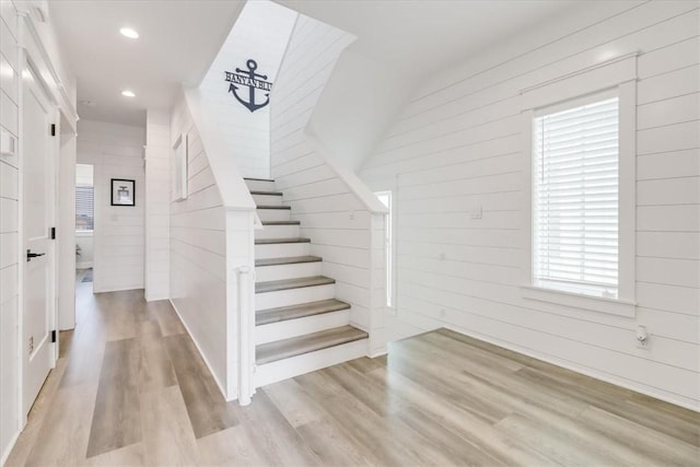 969 Banyan Beach Dr, Port Aransas, TX 78373 - stairs with wood finished floors, recessed lighting, and wood walls