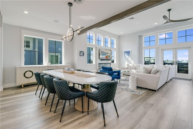 969 Banyan Beach Dr, Port Aransas, TX 78373 - dining space featuring light wood-style flooring, a chandelier, beam ceiling, recessed lighting, and ceiling fan