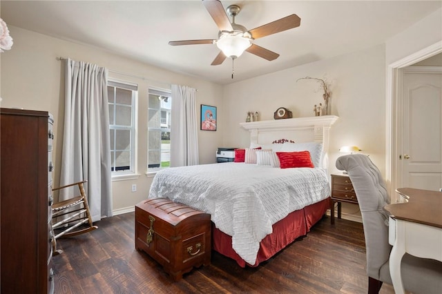 bedroom featuring dark wood-type flooring, a ceiling fan, and baseboards